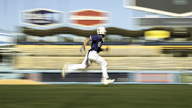 baseball player running the bases at game