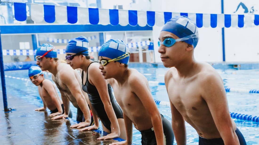 stack.com – us center for safesport swim image image of youth swimmers practicing together in pool
